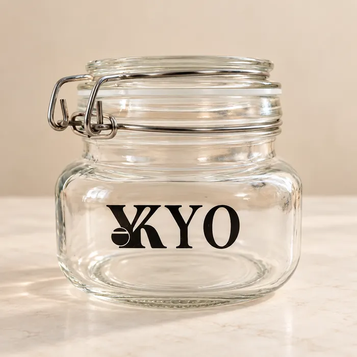Clamp-lid glass jar printed with the black KYO logo