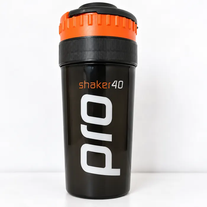 Black plastic shaker bottle with an orange lid, round printed with the shaker40 pro name